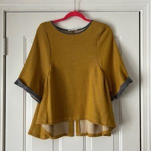 Like new, yellow, batwing blouse.